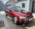Красный Опель Астра, объемом двигателя 1.6 л и пробегом 300 тыс. км за 3500 $, фото 1 на Automoto.ua