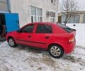 Красный Опель Астра, объемом двигателя 1.4 л и пробегом 230 тыс. км за 1500 $, фото 1 на Automoto.ua