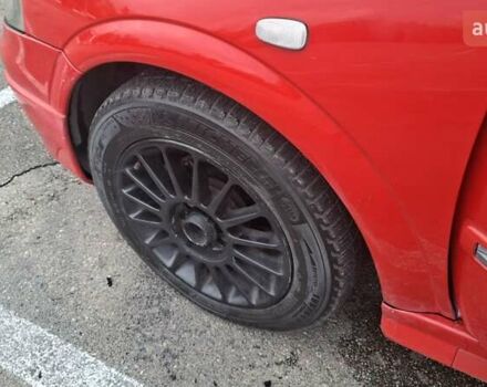 Красный Опель Астра, объемом двигателя 1.6 л и пробегом 220 тыс. км за 3300 $, фото 10 на Automoto.ua