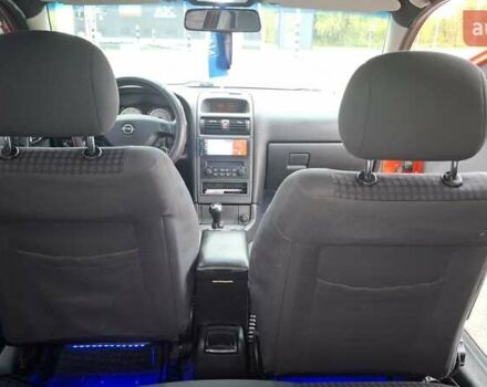 Красный Опель Астра, объемом двигателя 1.6 л и пробегом 220 тыс. км за 3300 $, фото 13 на Automoto.ua