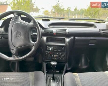 Красный Опель Астра, объемом двигателя 1.6 л и пробегом 223 тыс. км за 3300 $, фото 2 на Automoto.ua