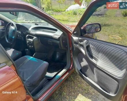 Красный Опель Астра, объемом двигателя 1.6 л и пробегом 223 тыс. км за 3300 $, фото 6 на Automoto.ua