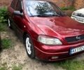 Червоний Опель Астра, об'ємом двигуна 1.4 л та пробігом 200 тис. км за 2600 $, фото 1 на Automoto.ua
