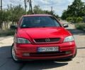 Красный Опель Астра, объемом двигателя 1.4 л и пробегом 283 тыс. км за 3200 $, фото 1 на Automoto.ua