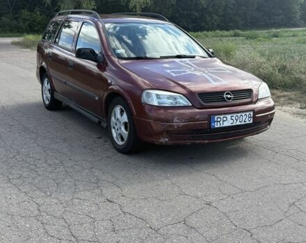 Красный Опель Астра, объемом двигателя 2 л и пробегом 300 тыс. км за 1250 $, фото 2 на Automoto.ua
