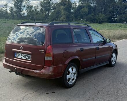 Красный Опель Астра, объемом двигателя 2 л и пробегом 300 тыс. км за 1250 $, фото 3 на Automoto.ua