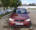 Красный Опель Астра, объемом двигателя 1.4 л и пробегом 210 тыс. км за 3400 $, фото 1 на Automoto.ua