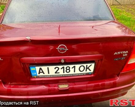 Красный Опель Астра, объемом двигателя 1.6 л и пробегом 251 тыс. км за 3000 $, фото 12 на Automoto.ua