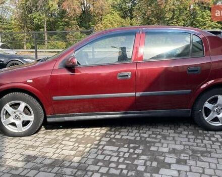 Красный Опель Астра, объемом двигателя 1.6 л и пробегом 218 тыс. км за 3900 $, фото 3 на Automoto.ua