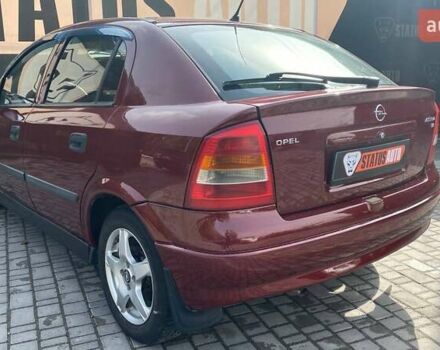 Красный Опель Астра, объемом двигателя 1.6 л и пробегом 218 тыс. км за 3900 $, фото 6 на Automoto.ua