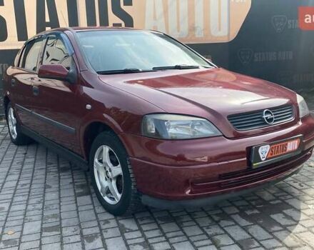 Красный Опель Астра, объемом двигателя 1.6 л и пробегом 218 тыс. км за 3900 $, фото 1 на Automoto.ua