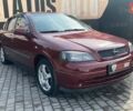 Красный Опель Астра, объемом двигателя 1.6 л и пробегом 218 тыс. км за 3900 $, фото 1 на Automoto.ua