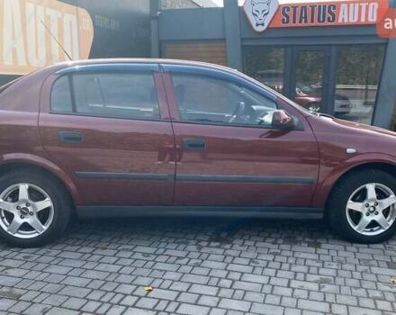 Красный Опель Астра, объемом двигателя 1.6 л и пробегом 218 тыс. км за 3900 $, фото 4 на Automoto.ua
