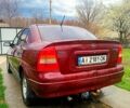 Красный Опель Астра, объемом двигателя 1.6 л и пробегом 251 тыс. км за 3000 $, фото 2 на Automoto.ua