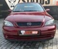 Красный Опель Астра, объемом двигателя 1.6 л и пробегом 218 тыс. км за 3900 $, фото 2 на Automoto.ua