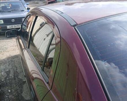 Червоний Опель Астра, об'ємом двигуна 1.4 л та пробігом 247 тис. км за 2300 $, фото 27 на Automoto.ua