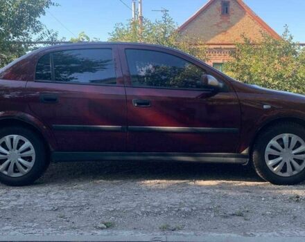 Красный Опель Астра, объемом двигателя 1.6 л и пробегом 285 тыс. км за 3000 $, фото 2 на Automoto.ua