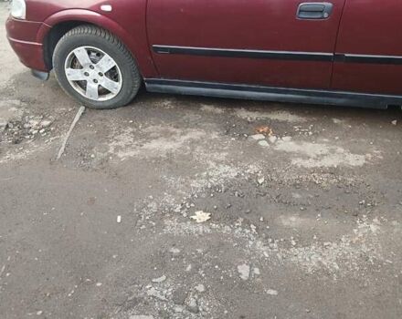 Червоний Опель Астра, об'ємом двигуна 1.4 л та пробігом 247 тис. км за 2300 $, фото 4 на Automoto.ua