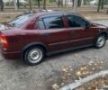 Красный Опель Астра, объемом двигателя 1.39 л и пробегом 300 тыс. км за 3400 $, фото 3 на Automoto.ua