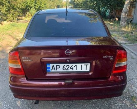 Красный Опель Астра, объемом двигателя 1.6 л и пробегом 285 тыс. км за 3000 $, фото 4 на Automoto.ua