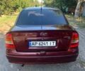 Красный Опель Астра, объемом двигателя 1.6 л и пробегом 285 тыс. км за 3000 $, фото 4 на Automoto.ua