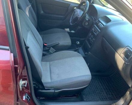 Красный Опель Астра, объемом двигателя 1.6 л и пробегом 285 тыс. км за 3000 $, фото 11 на Automoto.ua