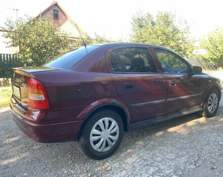 Красный Опель Астра, объемом двигателя 1.6 л и пробегом 285 тыс. км за 3000 $, фото 3 на Automoto.ua