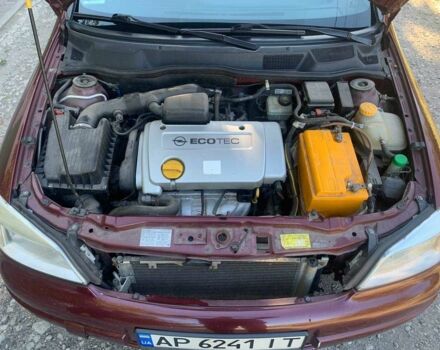 Красный Опель Астра, объемом двигателя 1.6 л и пробегом 285 тыс. км за 3000 $, фото 8 на Automoto.ua