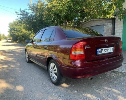 Красный Опель Астра, объемом двигателя 1.6 л и пробегом 285 тыс. км за 3000 $, фото 5 на Automoto.ua