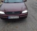 Красный Опель Астра, объемом двигателя 1.39 л и пробегом 300 тыс. км за 3400 $, фото 1 на Automoto.ua