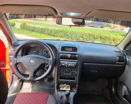 Красный Опель Астра, объемом двигателя 1.6 л и пробегом 224 тыс. км за 4500 $, фото 4 на Automoto.ua