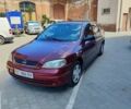 Красный Опель Астра, объемом двигателя 1.39 л и пробегом 180 тыс. км за 1700 $, фото 1 на Automoto.ua