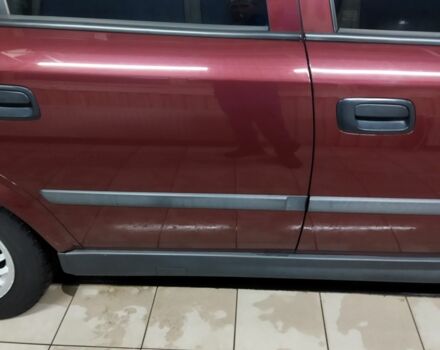 Красный Опель Астра, объемом двигателя 1.4 л и пробегом 420 тыс. км за 3200 $, фото 2 на Automoto.ua