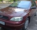 Красный Опель Астра, объемом двигателя 1.39 л и пробегом 144 тыс. км за 2999 $, фото 1 на Automoto.ua