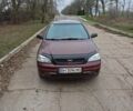 Красный Опель Астра, объемом двигателя 1.4 л и пробегом 170 тыс. км за 3300 $, фото 1 на Automoto.ua