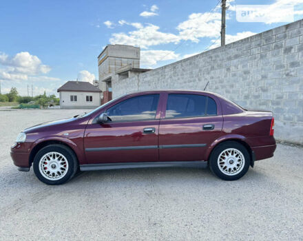 Красный Опель Астра, объемом двигателя 1.4 л и пробегом 183 тыс. км за 4200 $, фото 2 на Automoto.ua