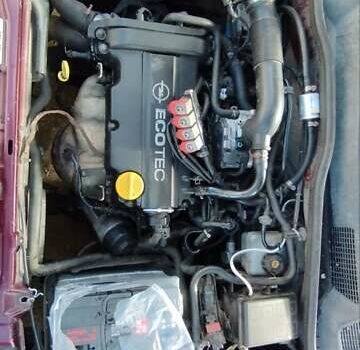 Красный Опель Астра, объемом двигателя 1.4 л и пробегом 297 тыс. км за 2500 $, фото 6 на Automoto.ua