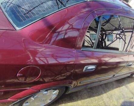 Красный Опель Астра, объемом двигателя 1.4 л и пробегом 297 тыс. км за 2500 $, фото 8 на Automoto.ua