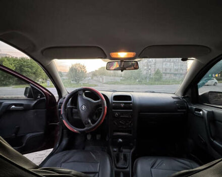 Червоний Опель Астра, об'ємом двигуна 1.4 л та пробігом 380 тис. км за 2850 $, фото 14 на Automoto.ua