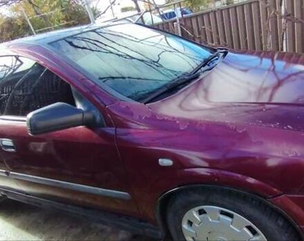 Красный Опель Астра, объемом двигателя 1.4 л и пробегом 297 тыс. км за 2500 $, фото 1 на Automoto.ua