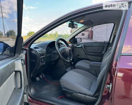 Красный Опель Астра, объемом двигателя 1.4 л и пробегом 183 тыс. км за 4200 $, фото 11 на Automoto.ua