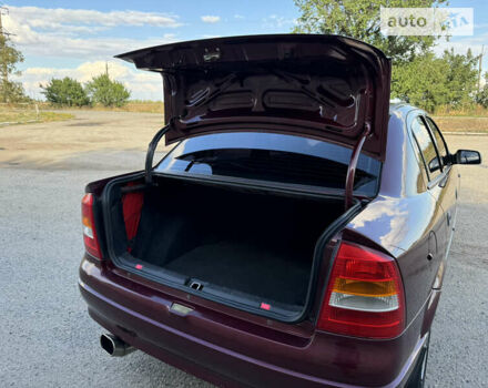 Красный Опель Астра, объемом двигателя 1.4 л и пробегом 183 тыс. км за 4200 $, фото 13 на Automoto.ua