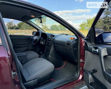 Красный Опель Астра, объемом двигателя 1.4 л и пробегом 183 тыс. км за 4200 $, фото 12 на Automoto.ua