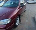 Красный Опель Астра, объемом двигателя 1.4 л и пробегом 226 тыс. км за 4500 $, фото 2 на Automoto.ua