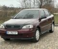 Красный Опель Астра, объемом двигателя 1.4 л и пробегом 245 тыс. км за 3400 $, фото 1 на Automoto.ua