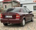 Красный Опель Астра, объемом двигателя 1.4 л и пробегом 245 тыс. км за 3400 $, фото 2 на Automoto.ua