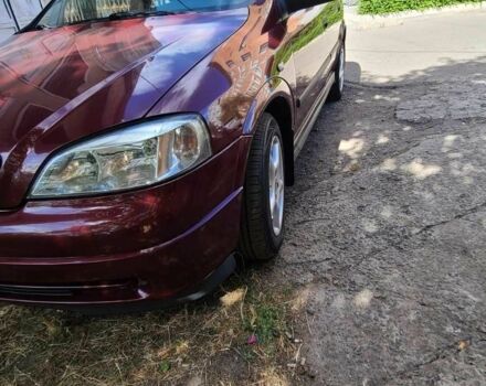 Красный Опель Астра, объемом двигателя 1.4 л и пробегом 226 тыс. км за 4500 $, фото 5 на Automoto.ua