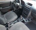 Красный Опель Астра, объемом двигателя 1.4 л и пробегом 198 тыс. км за 2999 $, фото 22 на Automoto.ua