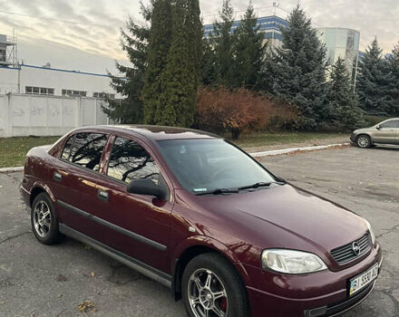 Красный Опель Астра, объемом двигателя 1.39 л и пробегом 187 тыс. км за 4800 $, фото 2 на Automoto.ua