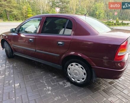 Красный Опель Астра, объемом двигателя 1.4 л и пробегом 285 тыс. км за 3100 $, фото 5 на Automoto.ua